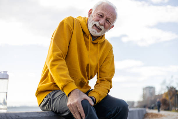 istock Active senior man experiencing knee pain while exercising outdoor 1934675335