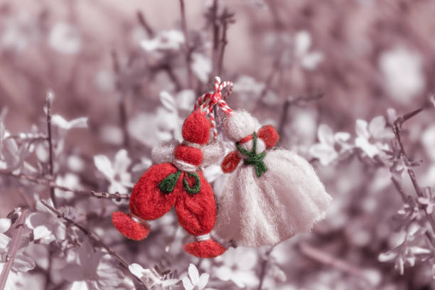 istock Spring beginning symbol - Martenitsa on blossoming tree. 1st March holiday. Spring background garden tree flowers bloom 1934702455