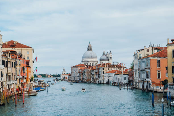 famous view of venice grand canal with saint mary of health dome on sunny day from ponte dell'accademia bridge. italian travel destination and landmark, tourist attraction. - venice italy beautiful accademia bridge grand canal стоковые фото и изображения