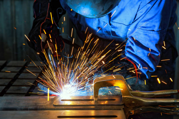 istock When workers weld using gas argon to steel, sparks are created that result in smoke within a factory 1934741102