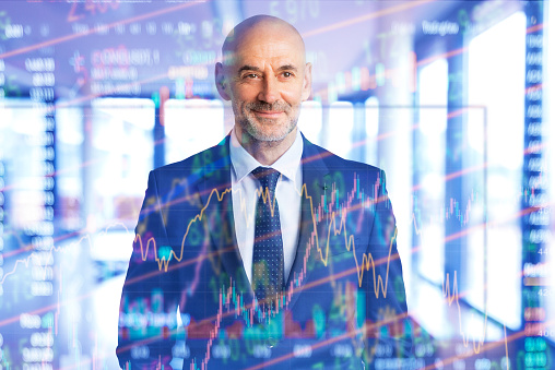 Digital composite of data graph over serious businessman standing in suit. Executive professional man standing in the conference room.