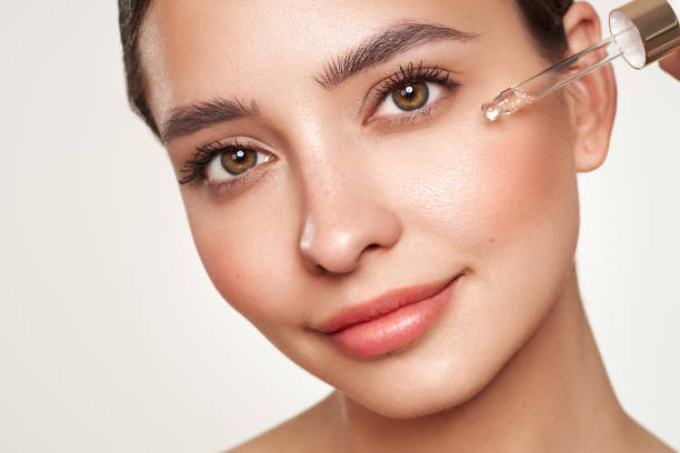 istock Young beautiful woman applying face serum 1934762664