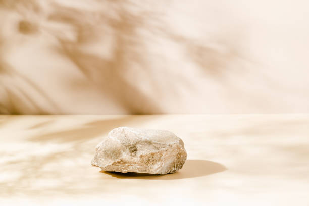 istock Stone podium with shadows on beige and brown background 1934767711