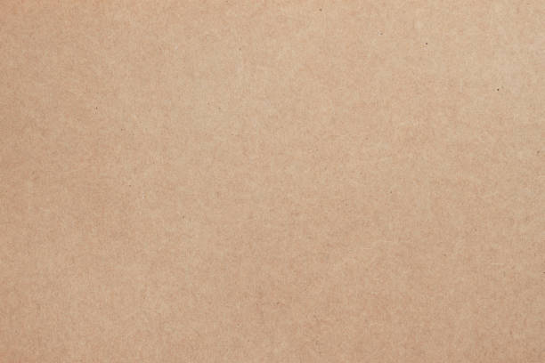texture of old organic cardboard, beige paper, background for design. recyclable material - kraft kağıdı stok fotoğraflar ve resimler