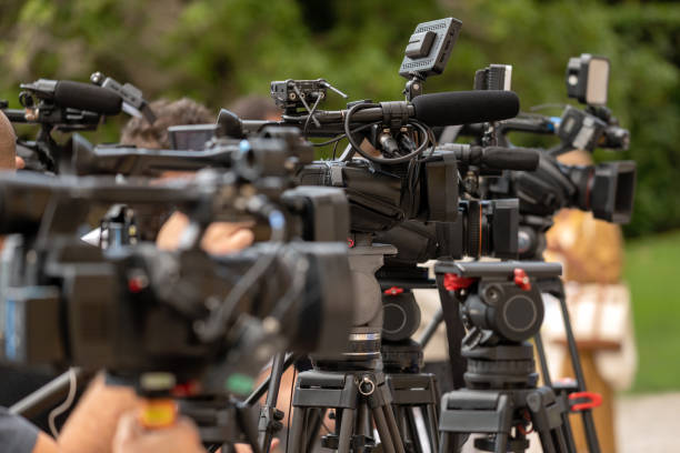 istock Video cameras on tripods during conference 1934784012