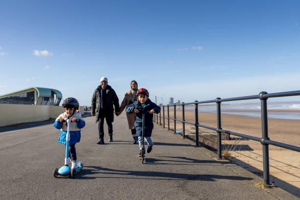 istock Leisurely Walk and Scooter Along a Promenade 1934790061