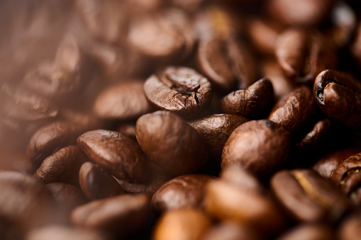 Close up of roasted coffee beans background.