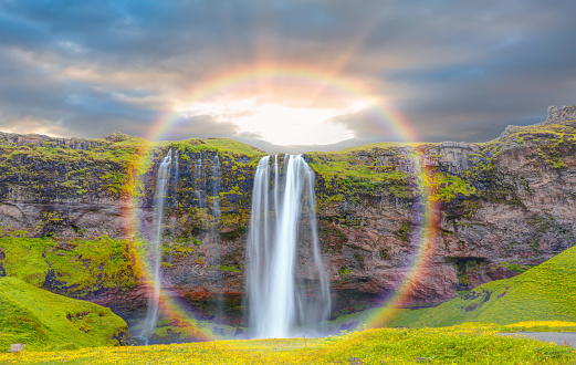 Amazing Seljalandsfoss waterfall with  rounded rainbow - Iceland