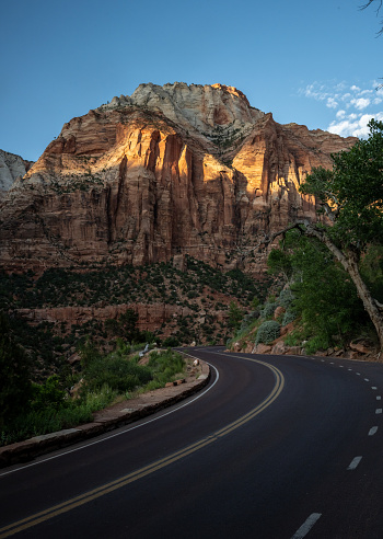 Looks Up At A Band Of Light Across East Temple in Zion