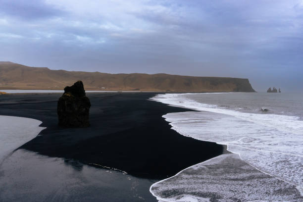 Arnardrangur black sand beach in Dyrhólaey nature reserve in Iceland stock photo