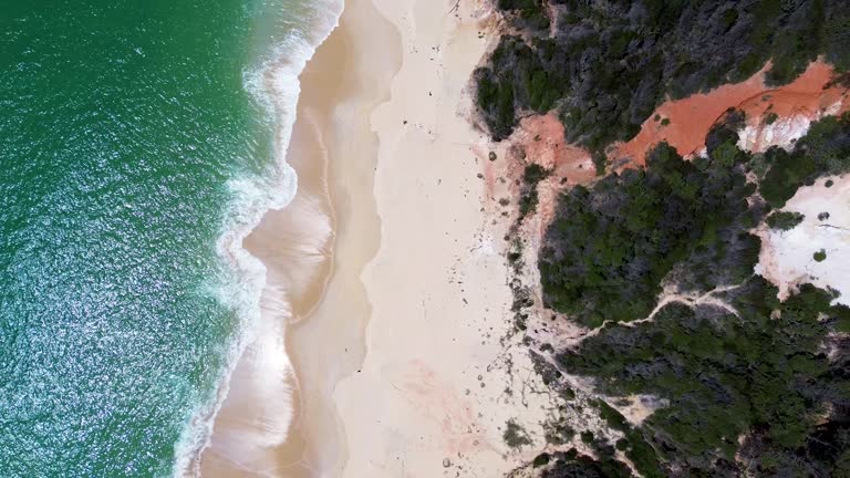 Drone aerial bird's-eye landscape sandy beach ocean rock formation walking track travel tourism Beowa National Park Pinnacles Eden NSW Australia