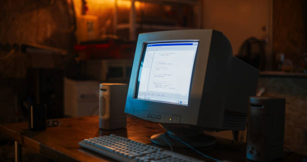 istock Close Up Shot Of Old Desktop Computer On Work Desk Of Software Developer In Retro Garage. Dated PC Has Operating System Terminal Opened, Prompts Running On Screen, Code Functioning Successfully. 1934840208