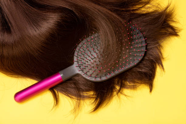 istock A brown female wig with a hairbrush 1934843390