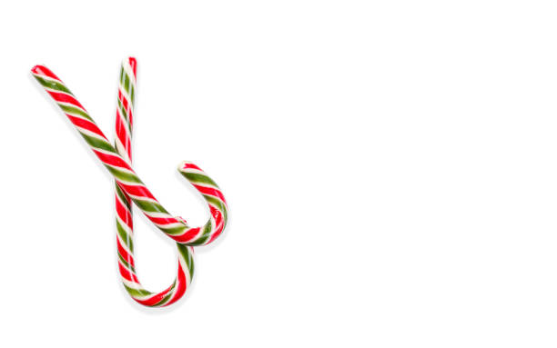 istock New Year's sticks candy canes with stripes on a white isolated background 1934852373