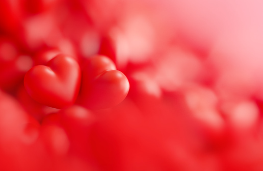 Red Valentine's Day background formed by red hearts. Horizontal composition.