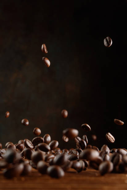 istock Many roasted coffee beans flying in the air. 1934878270