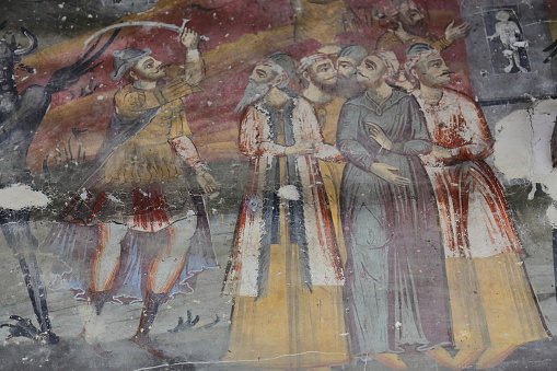 Permet, Albania-April 17, 2019: Saint Mary's Church of Leusa dates from the 18th century, built on older Byzantine-era remains. Wall paintings from 1812 depicting Bible scenes, unidentified characters