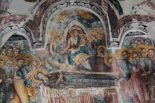 Permet, Albania-April 17, 2019: Saint Mary's Church of Leusa dates from the 18th century, built on older Byzantine-era remains. Wall paintings from 1812 depicting Bible scenes, Dormition of the Virgin