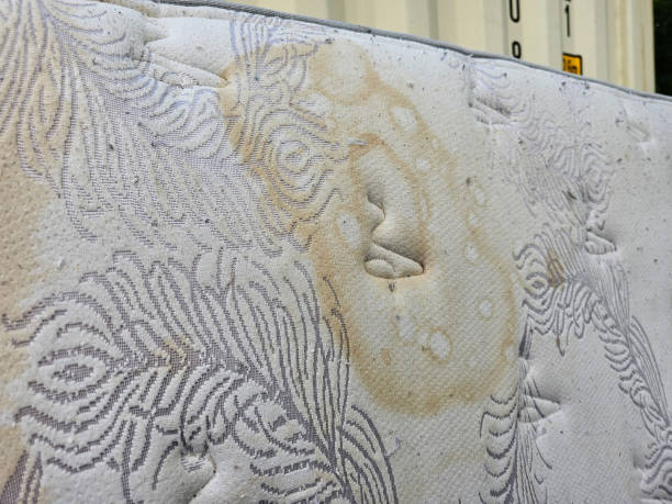 Stain on mattress A closeup of an old stain on a mattress. overflowing trash dumpster stock pictures, royalty-free photos & images