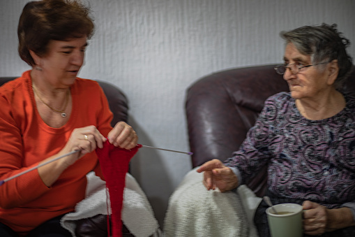 Knitting, elderly woman