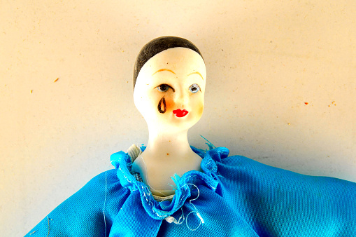 Photo of Pierrot toy doll on white background