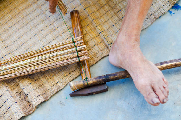 Mid adult man washing a kimono obi after dyeing in Okinawa, Japan