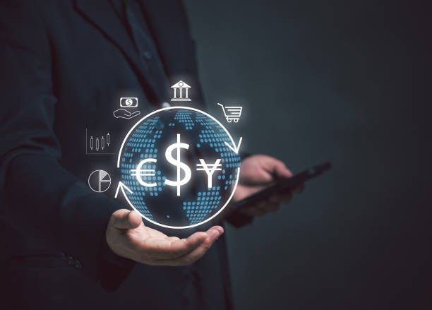 istock Businessman holding virtual globe with foreign currency icons using mobile phone to send money exchange orders. Concept of global currency exchange. Financial currency trade and investment. 1934935825