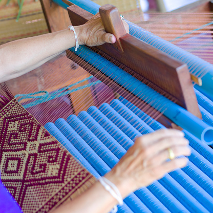 Thai mature woman is  doing loom work and craft  in province of Phitsanulok