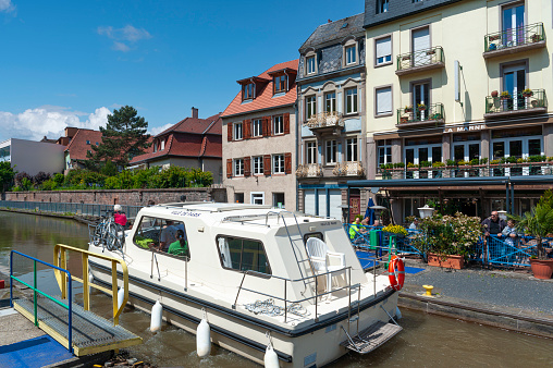 Saverne, France - May 26, 2022: Houseboat in lock of Rhine-Marne Canal in Saverne. Department Bas-Rhin in the Alsace region of France