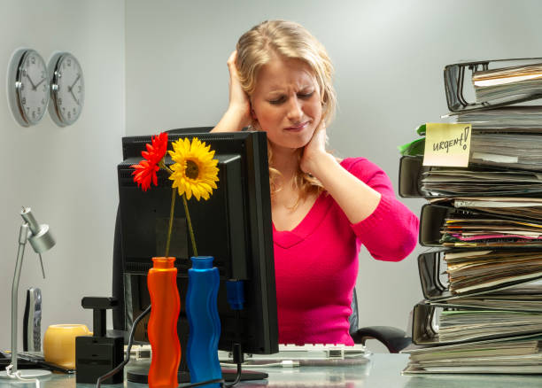 istock Young woman in office working late 1935152363