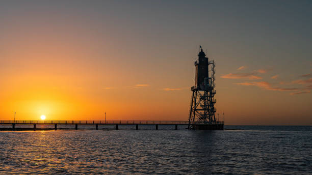 istock Obereversand lighthouse at sunset 1935154999