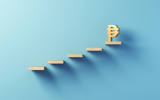 3d render Leadership Ladder ,Golden Metallic Peso Symbol at the Top of Wooden Stairs on Blue Soft Wall, Concepts of leadership, goal concept, project management, company strategy (Close-up)