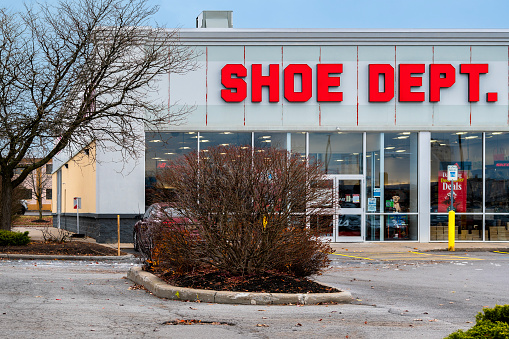 Rome, New York - Nov 21, 2023: Close-up of Shoe Dept. storefront, an American footwear retailer based in Concord, North Carolina and has 63 years of experience. Shoe Dept. is owned by Shoe Show, Inc.