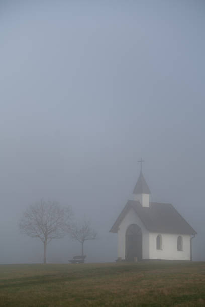 The Kottenborn chapel in dense fog. Compressed through the telephoto lens. Mystical atmosphere.