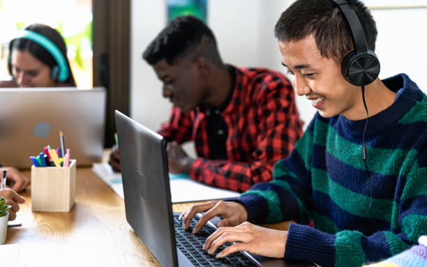 istock Young multiracial students home working together on school project - Education concept 1935197866