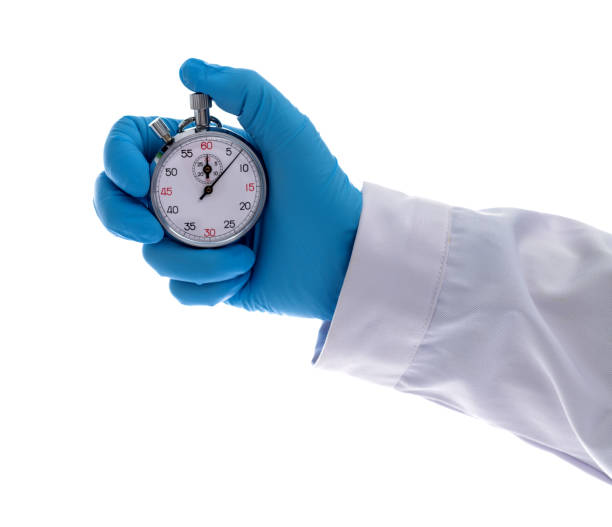 istock Doctor hand holding a stopwatch 1935198381