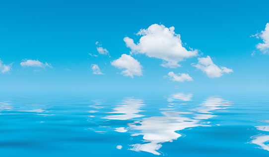 Blue sky and white cloud reflected in the water