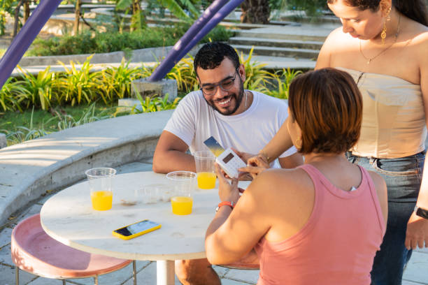 istock Casual Outdoor Payment Among Friends 1935200030