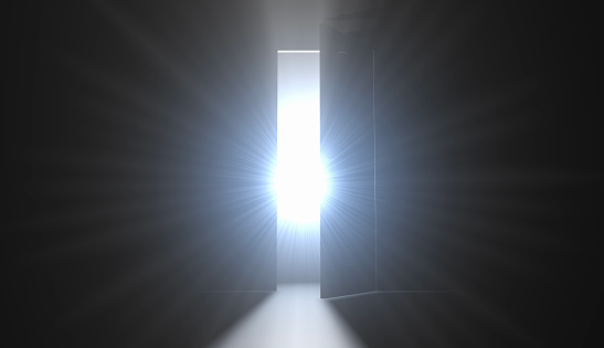 In every darkness there is hope. Light is leaking from the doorway of an empty dark room. / You can see the animation movie of this image from my iStock video portfolio. Video number: