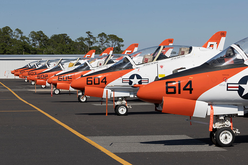 Flight line of Boeing US Navy T-45 Goshawk jet trainers parked at Gainesville Regional Airport Gainesville Florida photograph taken April 2021
