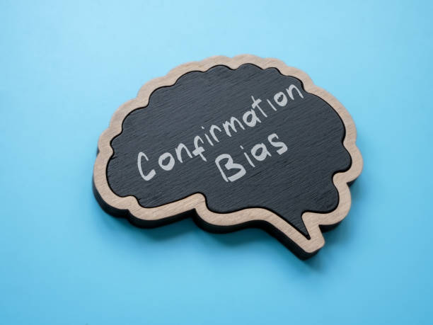 istock Brain outline and written inscription confirmation bias. 1935220720