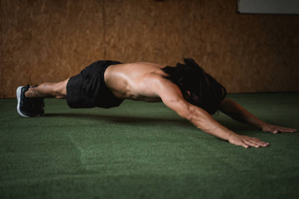 person doing plank in the gym