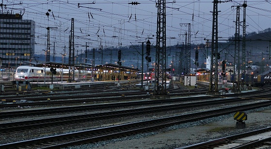 An Intercity Train leaves the station in the evening twilight