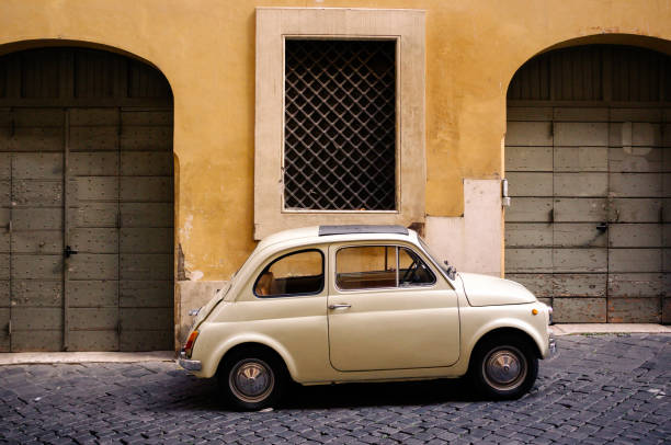 istock Small vintage car on a street in Rome 1935263294