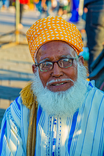 Marrakech,Morocco 19 May 2023:Portrait of elderly person with beard smiling in Jemaa el Fnaa square