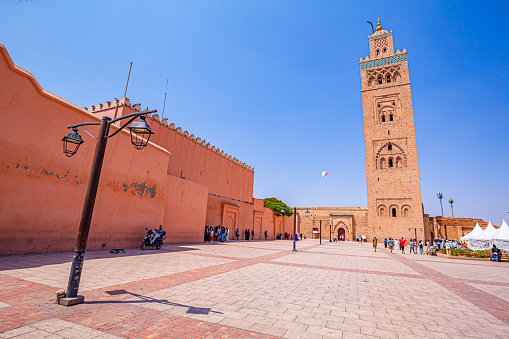 Marrakech,Morocco 20 May 2023:View of Koutoubia mosque square with stork in flight