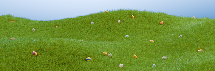 Many Easter colorful eggs on a meadow in the grass. 3D rendering