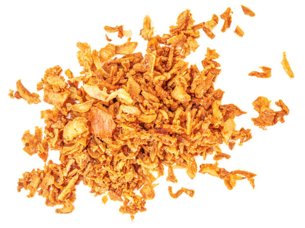 istock Crispy Roasted Onions isolated on white background. Dried fried onions Top view. Flat lay 1935321409