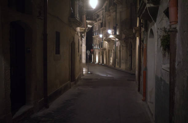 Narrow street at night, Ortigia, Siracusa stock photo