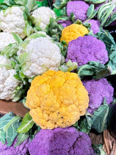 istock Colorful cauliflowers  head variations close up, vertical image 1935359408